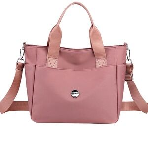 Nylon pink crossbody with shoulder handles. High density waterproof material.‎